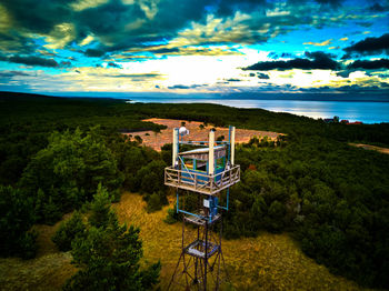 High angle view of gazebo by sea against sky