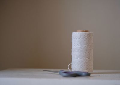 Close-up of thread spool on table