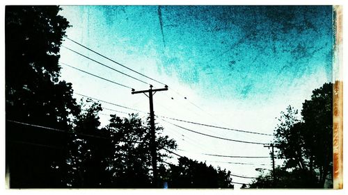 Low angle view of electricity pylon