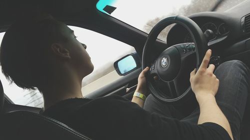 Close-up of man sitting in car