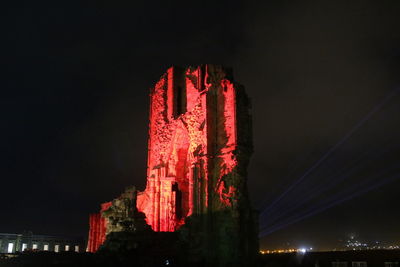 Low angle view of illuminated temple against sky at night