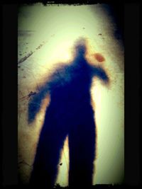 Shadow of man on wall