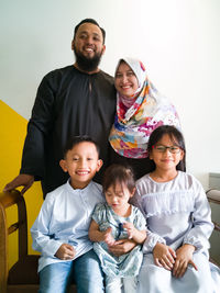 Portrait of happy family at home on eid-ul-fitr