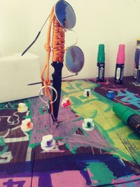 Close-up of multi colored umbrellas on table at home