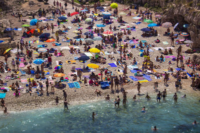High angle view of people enjoying at beach