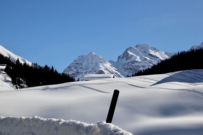 Snow covered mountain against sky