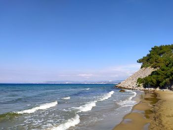 Scenic view of sea against blue sky