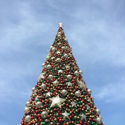 Low angle view of christmas tree against sky