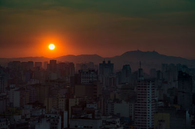 Cityscape against sky during sunset