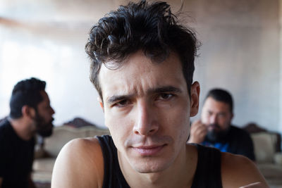 Close-up portrait of young man indoors