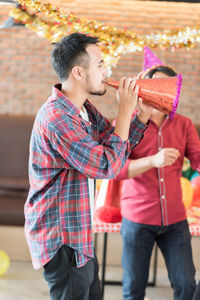 Young man enjoying during christmas party