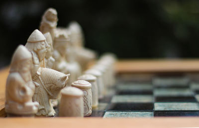 Close-up of chess pieces on table