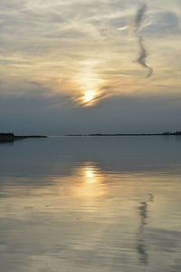Scenic view of sea against sky at sunset
