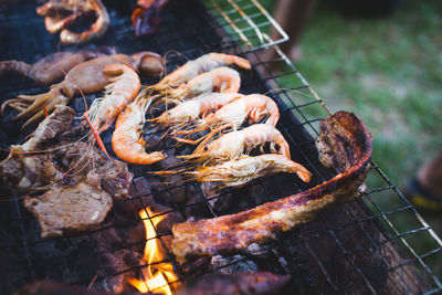 Close-up of meat on barbecue grill