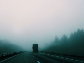 Empty road in foggy weather