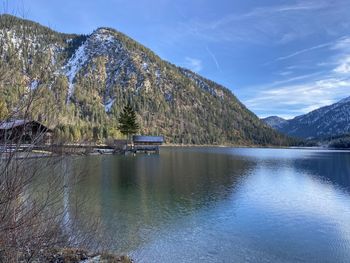 Scenic view of lake and mountains against sky
