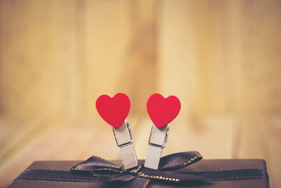 Close-up of red heart shape on table