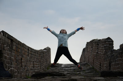 Low angle view of woman jumping