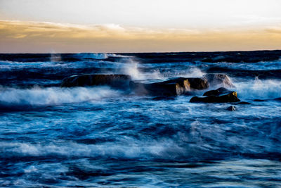 Waves splashing on rocks
