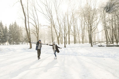 Senior couple ice skating