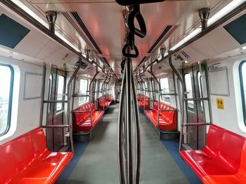 Train in illuminated underground walkway