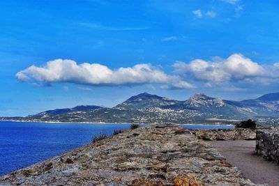 Scenic view of sea against blue sky