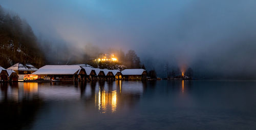 Scenic view of lake against sky at night