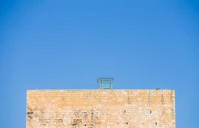 Low angle view of building against blue sky