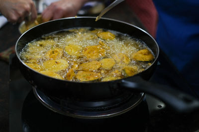 Close-up of frying pan with breaded vegetables 