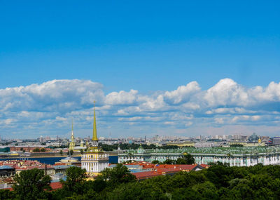 Panoramic view of buildings in city against sky