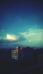 Buildings against sky at sunset