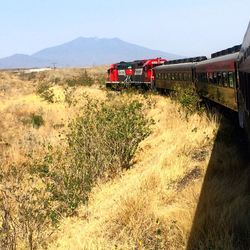 Train on railroad track against sky