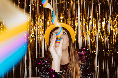 Portrait of young woman enjoying in party