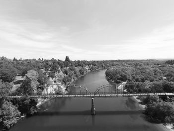 Bridge over river against sky