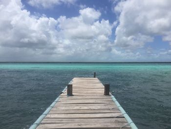 Pier over sea against sky