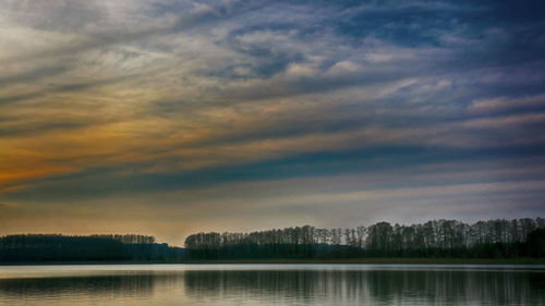 Scenic view of lake against sky during sunset