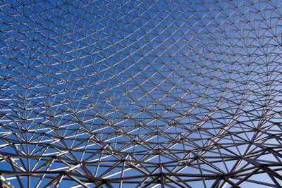 Full frame shot of metallic structure against blue sky