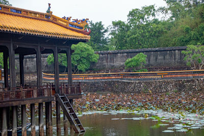 View of bridge over river against buildings