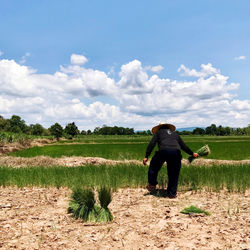 Full length of woman on field against sky