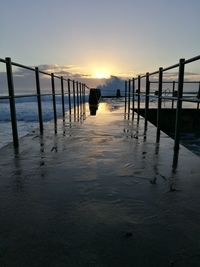 Scenic view of sea against sky at sunset