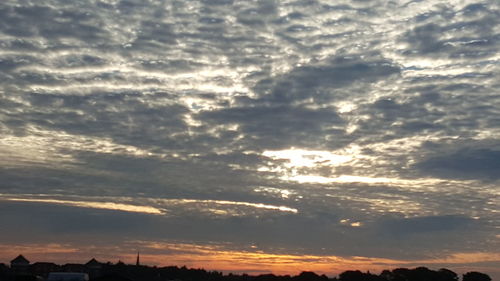 Low angle view of dramatic sky during sunset