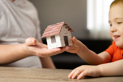 A father gives his son a small house. the concept of transfer of property and inheritance.