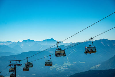 Low angle view of ski on snowcapped mountains against sky