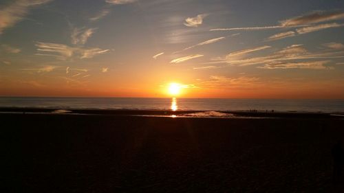 Scenic view of sea at sunset