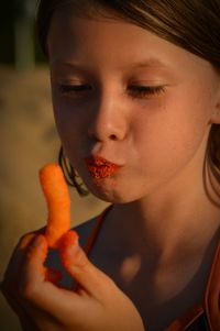 Close-up of girl eating snack