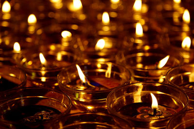 Close-up of diyas at night