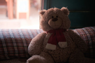 Close-up of stuffed toy on sofa at home