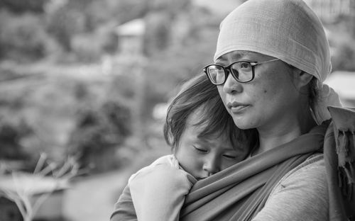 Portrait of mother and daughter outdoors