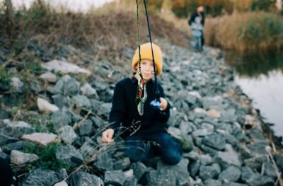 Man sitting on rock