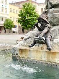 Statue of fountain in city
